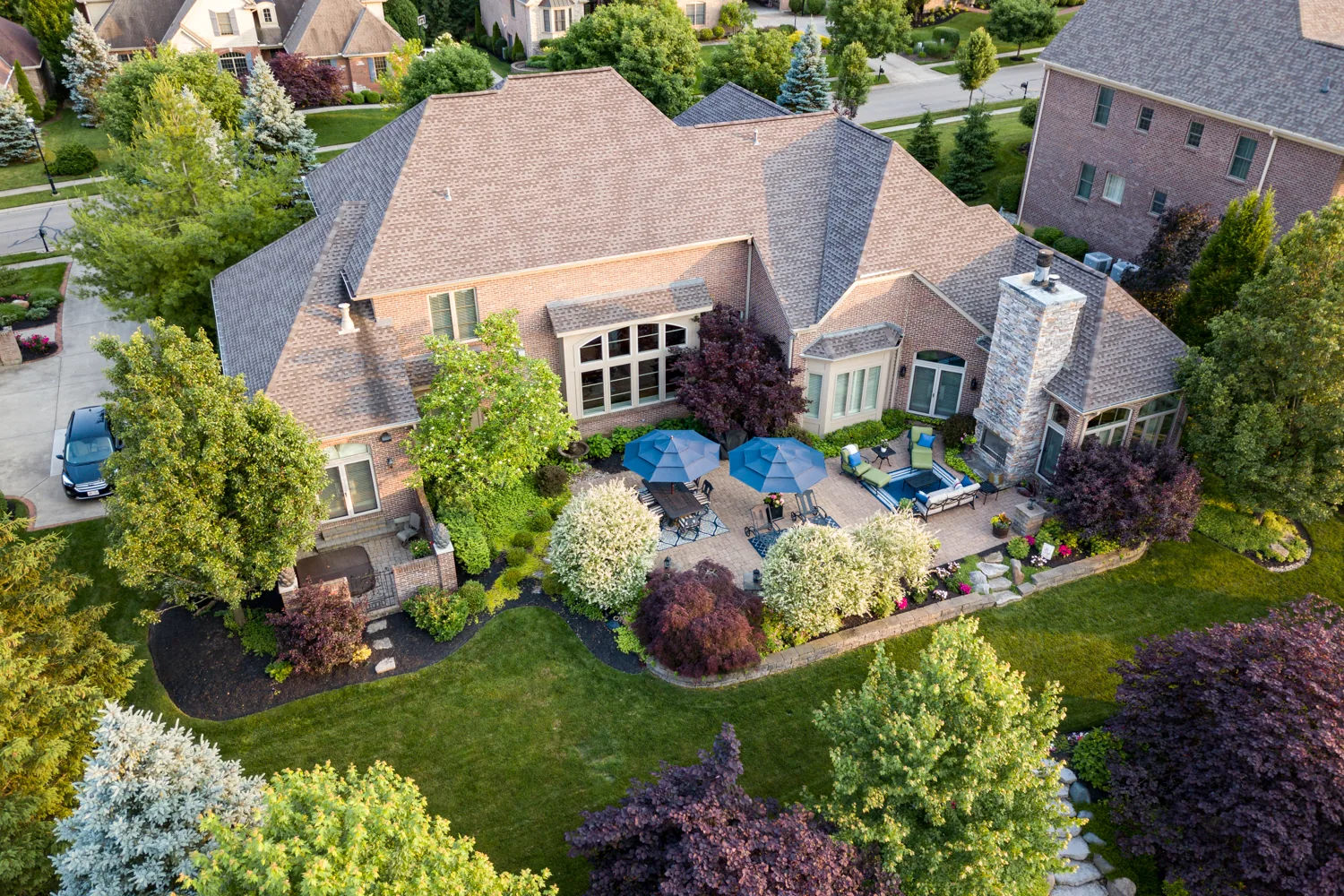 Aerial photograph showing a home, pool and surrounding landscape